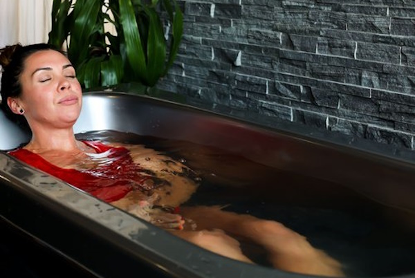 A woman relaxing in an ice bath